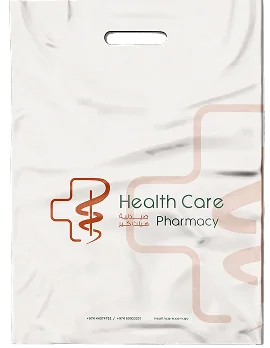 A white Health Care Pharmacy shopping bag