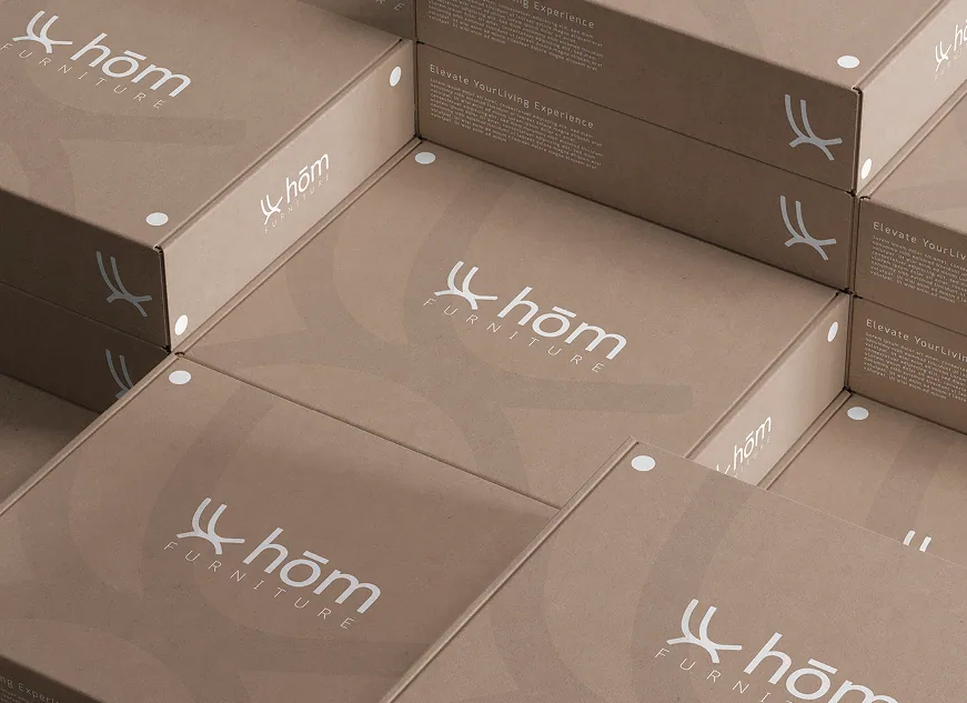 Stacks of hōm branded packaging boxes