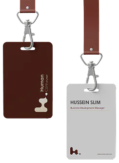 Two Human Care staff ID cards on branded lanyards