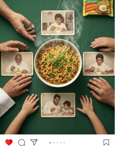 Indomie post: hands from four generations reaching for one bowl of noodles