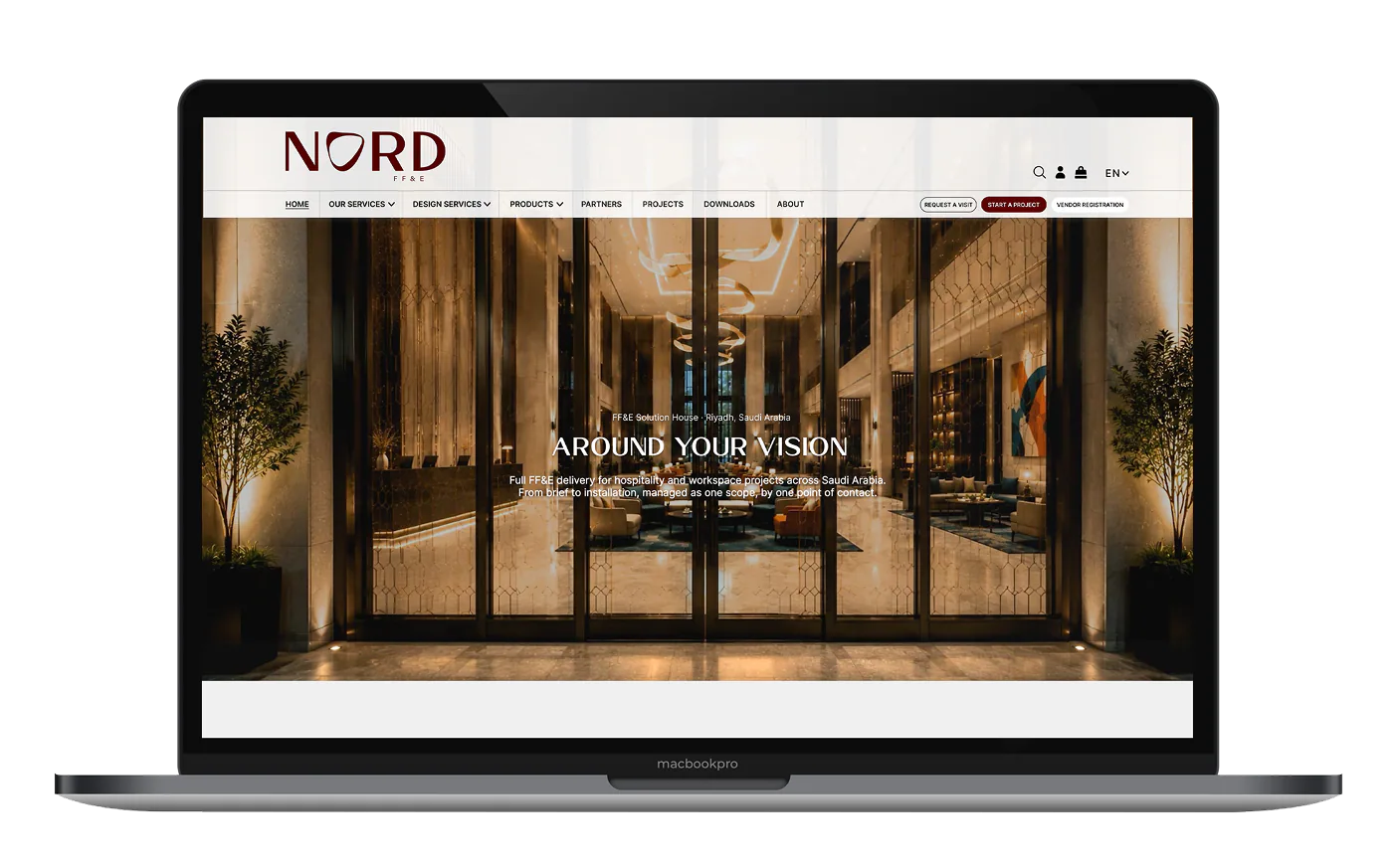 The Nord FF&E site open on a laptop: Around Your Vision, over a lit hotel lobby