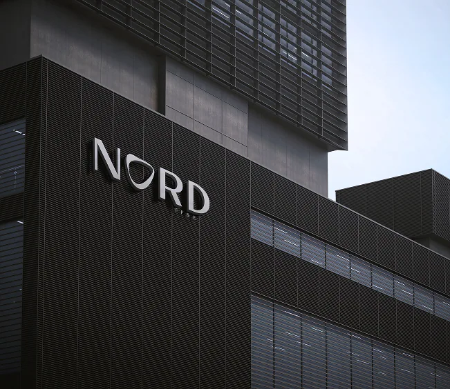 The Nord mark mounted on a dark building facade