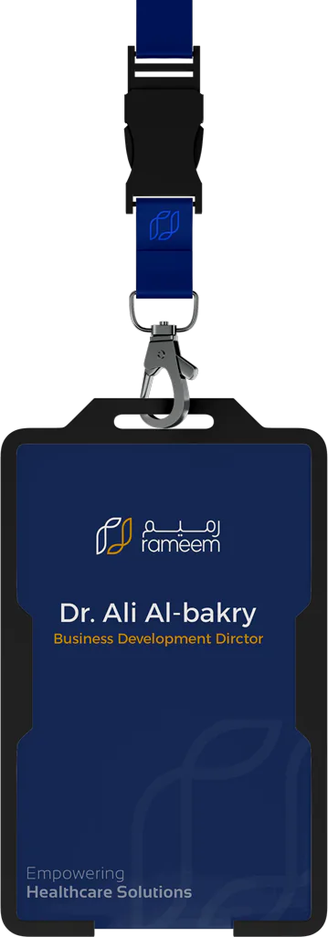 The staff badge on a navy lanyard, set for Dr. Ali Al-bakry, Business Development Director