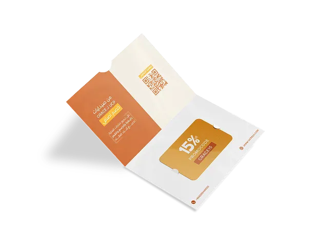 A UCP gift folder holding a 15% promocode card