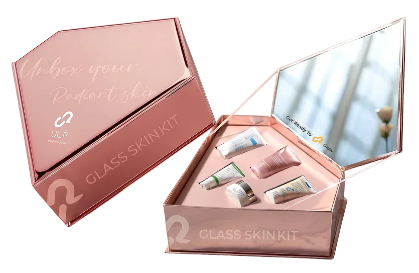 The rose-gold UCP Glass Skin Kit box, closed and open with its mirrored lid