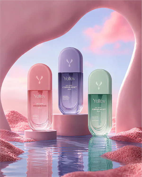 Three Yulluv anti-aging serums in pink, purple and green